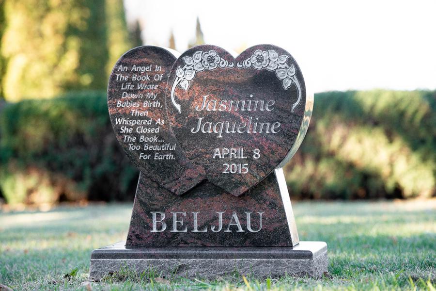This sweet little custom design double heart memorial and matching base can be found in the Brandon Cemetery. 
