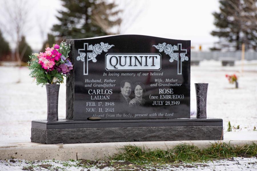 Quinit, this classic companion memorial can be found in Brookside cemetery. Customized with a matching base, a Diamond Impact Etched portrait and two tulip vases