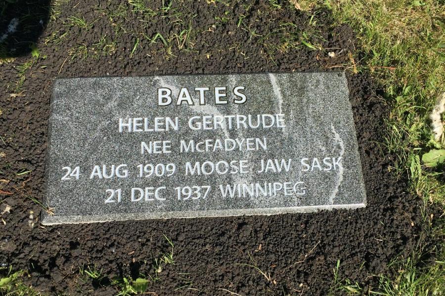 Bates, 20 x 10 x 4 Jet Mist flat grass memorial installed in St. Vital cemetery