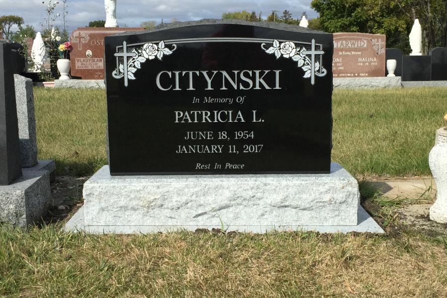 Citynski, traditional Midnight Black memorial installed in Holy Ghost cemetery.