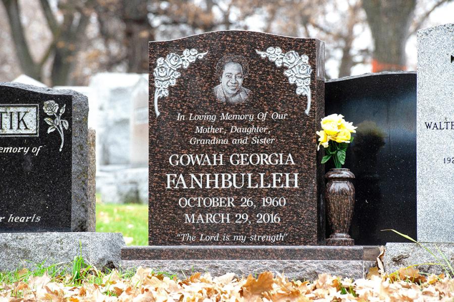 Fanhbulleh, an example of a single Dark Mahogany granite traditional style upright memorial. Customizations to this memorial are a matching polished top 2" margin base,  a matching granite vase and a Diamond impact etched portrait.