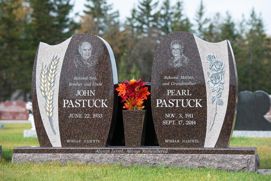  Cats Eye Brown Custom Design Granite Wing-style Memorial installed in Holy Family cemetery.