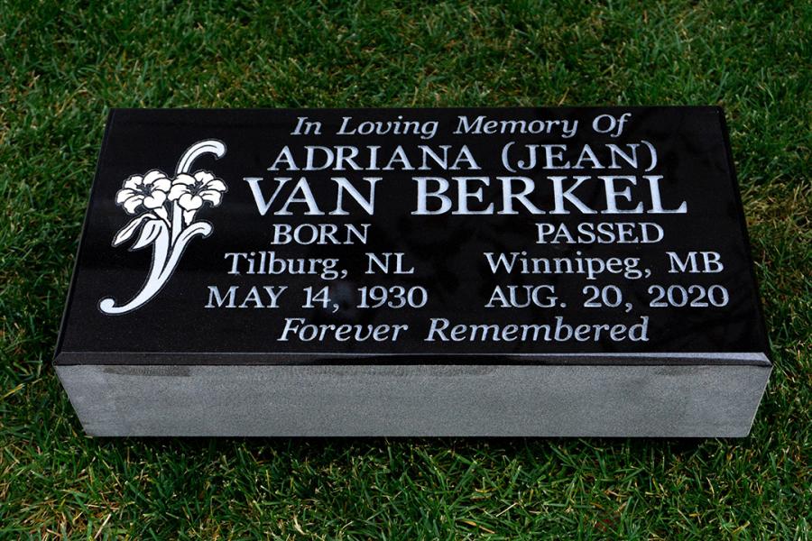 Van Berkal, a 20 x 10 x 4 Midnight Black Flat grave marker with floral design. All sandblasted designs and lettering that fit onto the face of the stone are included in our quotes. 