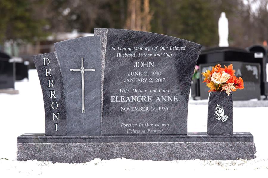 Debroni, Custom Design Bahama Blue Memorial installed in Holy Family cemetery. Featured add-ons, a stainless steel cross and matching vase on a 2" margin polished top base.