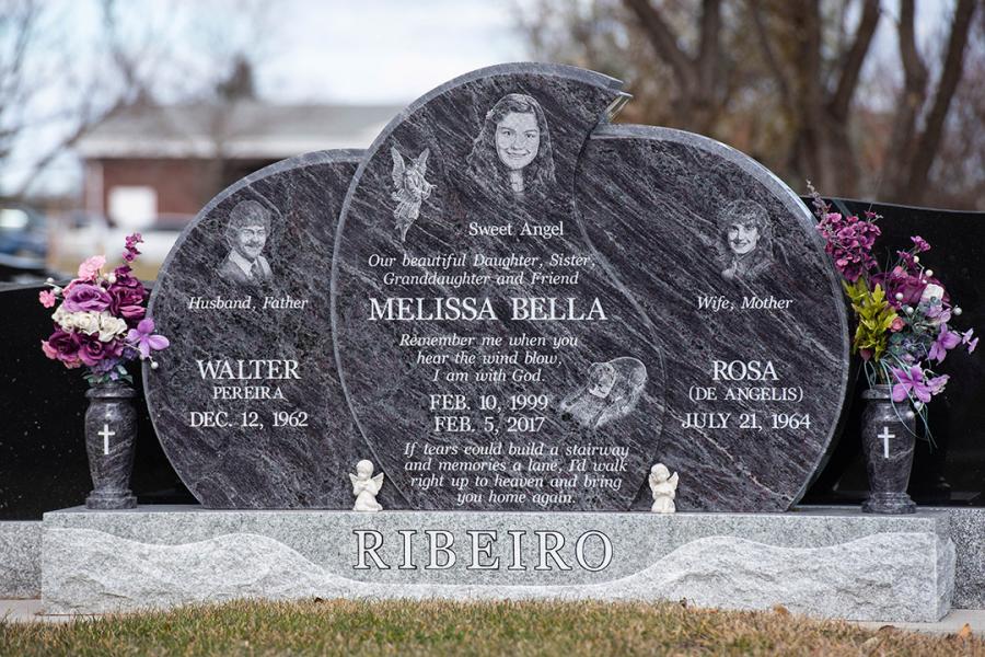 Ribeiro, a beautiful Custom Design Bahama Blue granite memorial. Featured add-ons, Diamond Impact Etched portraits, hobby & religious motifs, and two matching granite vases on a custom design Galaxy Grey base with family name. 