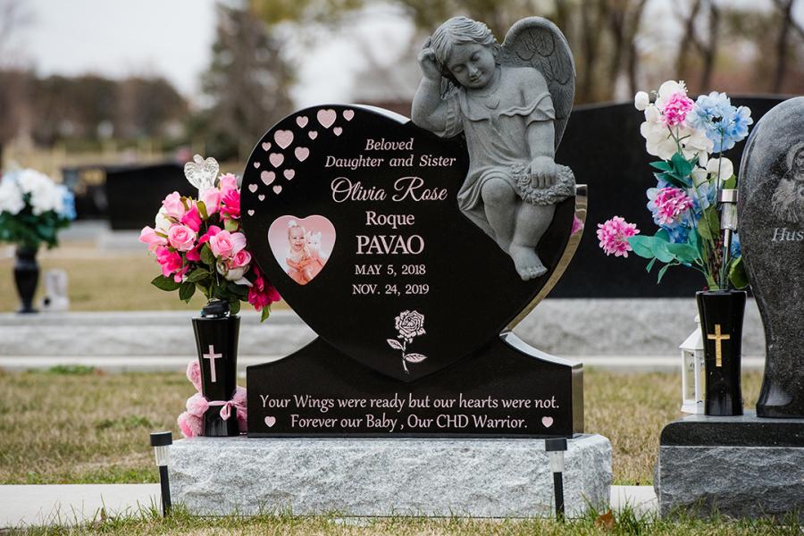This beautiful custom design Midnight Black heart & sculptured angel on a Galaxy Grey base with rose paint detailing's, picture and a vase  can be found in the Assumption Cemetery