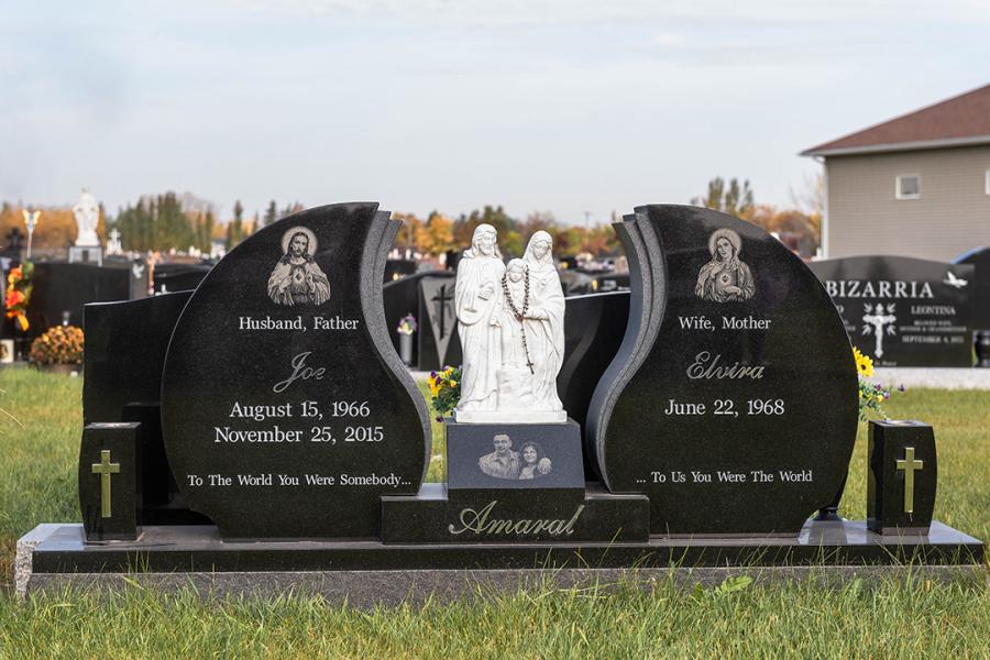 Amaral, Custom Design Midnight Black Wing Style Memorial. Featured add-ons, Statues, Diamond Impact Etched portraits, matching black vases, with stainless steel given & family name on a matching polish top 2" margin base.