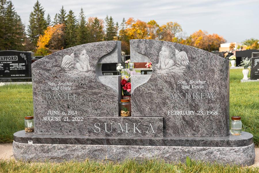 Sumka, Custom Design Bahama Blue Wing Style memorial. Featured add-ons, rounded matching polish top 2" margin base with Diamond Impact Etched angels. Located in Holy Family Cemetery.
