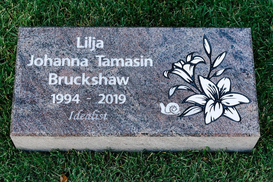 Bruckshaw, 24 x 12 x 4 Paradiso Granite Flat Grass marker with Lillie's and a small snail 