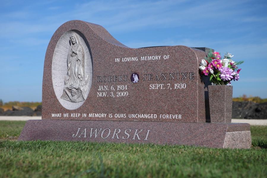 Jaworski, Custom Design sculptured memorial. Featured add-ons, matching granite vase on a matching slant base with family name