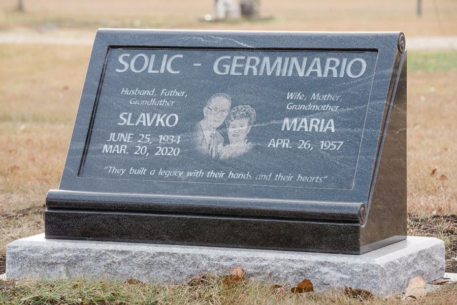This beautiful all polished custom design scrolled Hickey memorial in Jet Mist granite installed on a Galaxy Grey granite base.