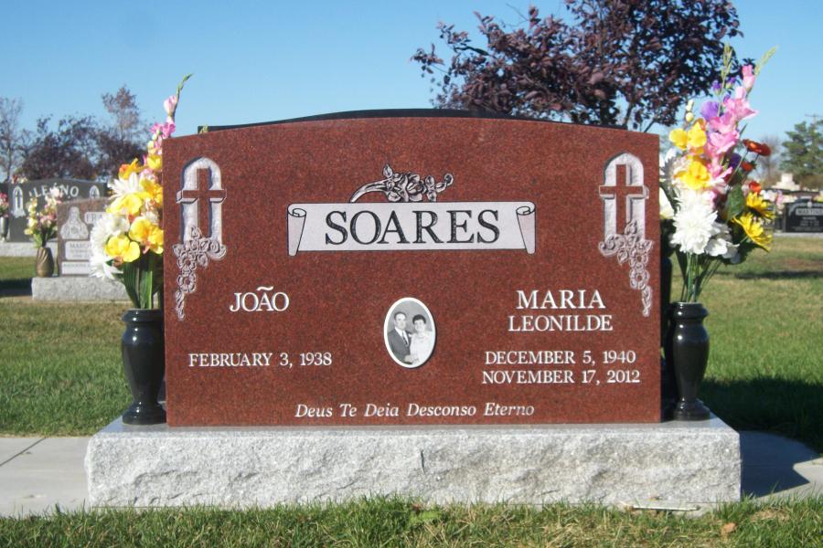 Soares, Imperial Red traditional style double memorial on a standard Galaxy Grey base with two Midnight Black granite vases located in the assumption Cemetery. 