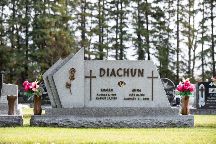 Diachun, Galaxy Grey custom design memorial with bronze lettering and motifs installed in Cooks Creek cemetery Cooks Creek, Manitoba
