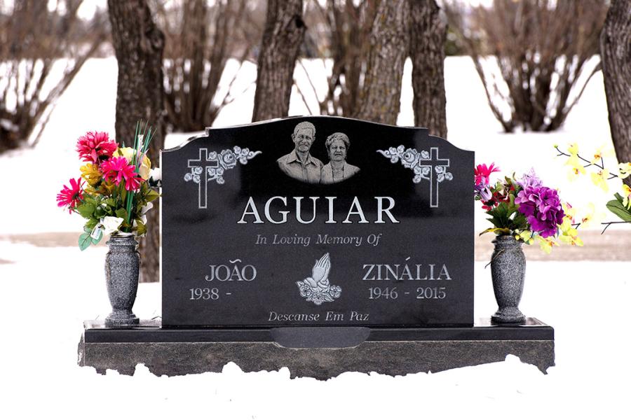 Aguiar, Midnight Black traditional double memorial installed in Assumption cemetery.