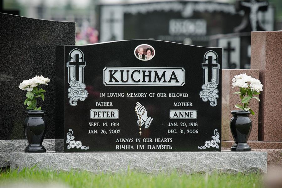 Kuchma, Midnight Black traditional double memorial installed in All Saints cemetery.