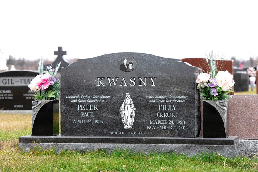 Kwasney, Jet Mist traditional memorial installed in Holy Family cemetery.