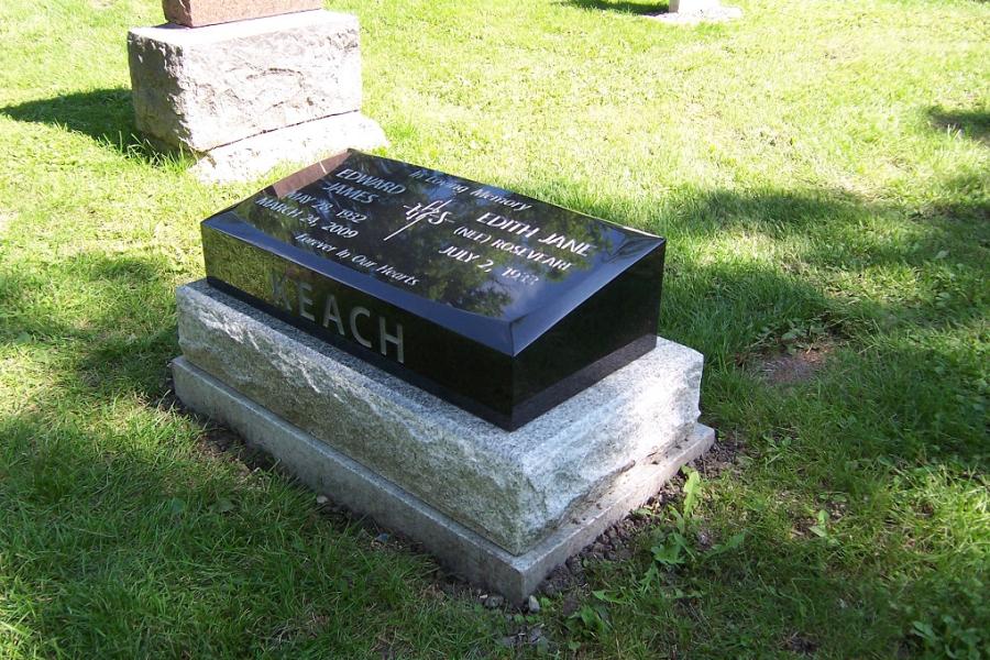 Keach, 30 x 14 x 8/5 Midnight Black custom bevel pillow marker installed in Historic Elmwood cemetery