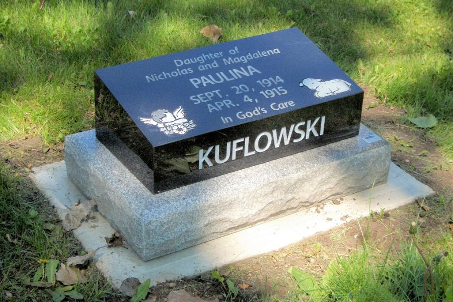 Kuflowski, 20 x 10 x 6/4 Midnight Black pillow marker installed in Brandon cemetery, Brandon, Manitoba