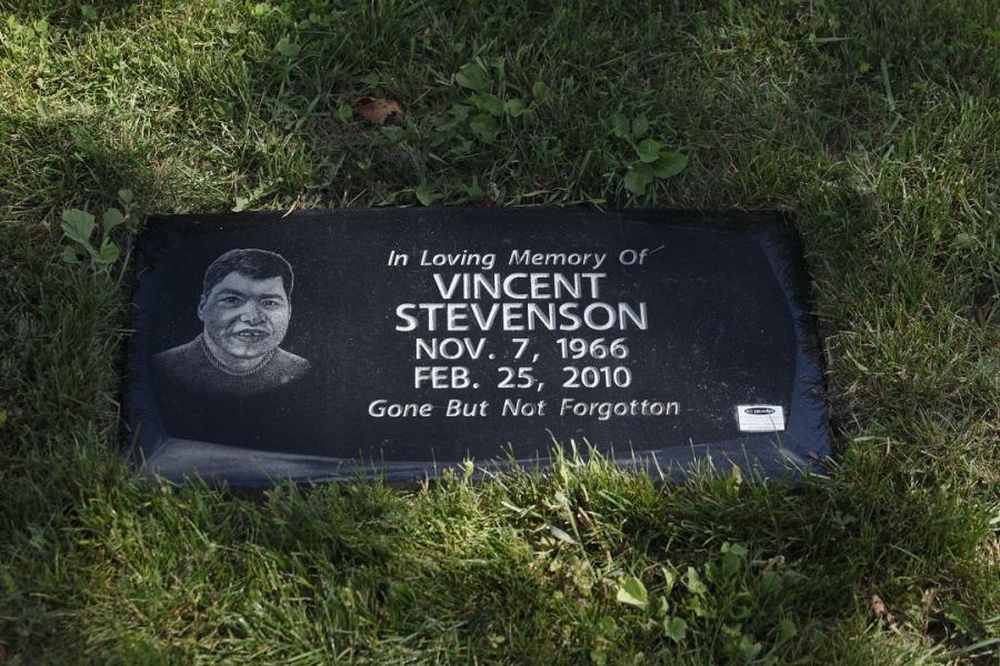 Stevenson, 24 x 12 x 4 Midnight Black custom bevel flat grass memorial installed in St. Vital cemetery