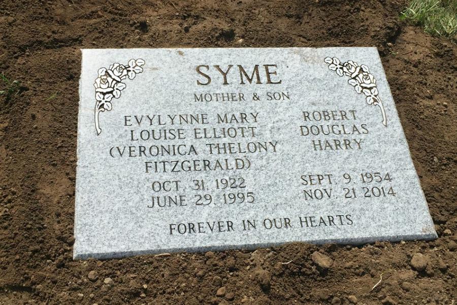 Syme, 28 x 20 x 4 Galaxy grey flat grass memorial installed in Birchwood cemetery, Swan River, Manitoba