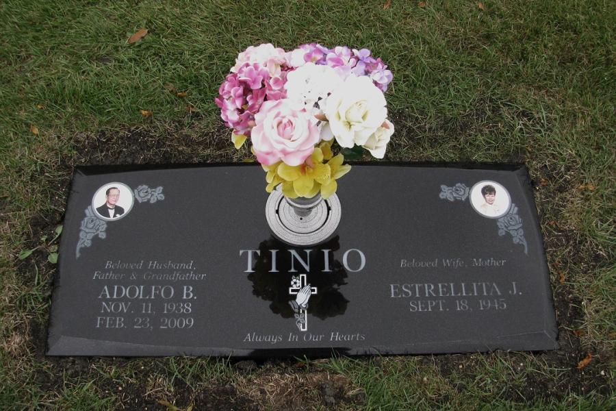 Tinio, 48 x 20 x 4 Midnight Black custom bevel with inground vase flat grass marker installed in Assumption cemetery