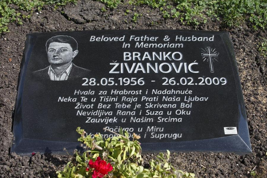 Zivanovic, 28 x 20 x 4 Midnight Black custom design flat grass memorial installed in St. Vital cemetery